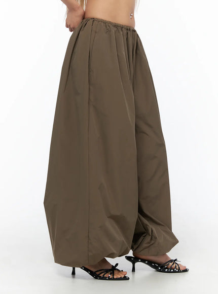 String Detail Parachute Pants CU524 Brown side shot on model showing voluminous balloon silhouette and gathered hem detail