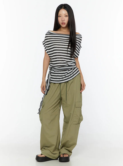 String Pocket Wide Pants CU526 Dark green full-body front shot on model wearing striped off-shoulder top, standing straight, showing full-length wide-leg fit