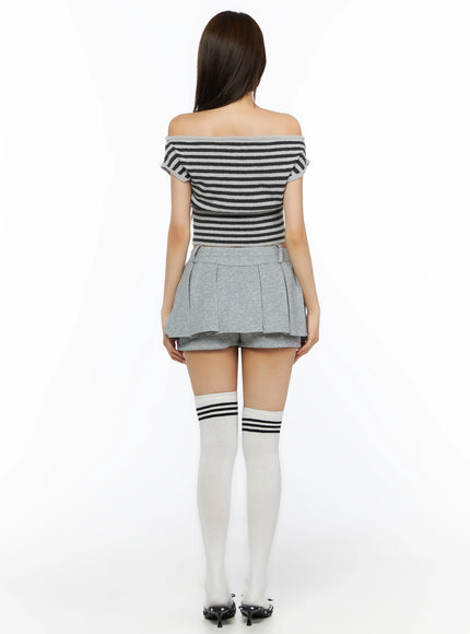 Stripe Off-Shoulder Knit Top IL506 Gray back view on model revealing off-shoulder back neckline and ribbed hem, styled with gray pleated skirt and white knee-high socks