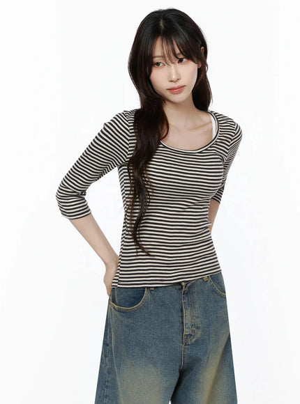 Striped 3/4 Long Sleeve Top IL506 Dark brown front close-up shot on model with hand on hip, lace inner camisole peeking at neckline, slim waist fit emphasized