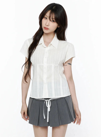 Striped Button-Up Blouse IL506 White cropped front shot on model showing point collar, button placket, empire waist seam, and sheer vertical stripe texture