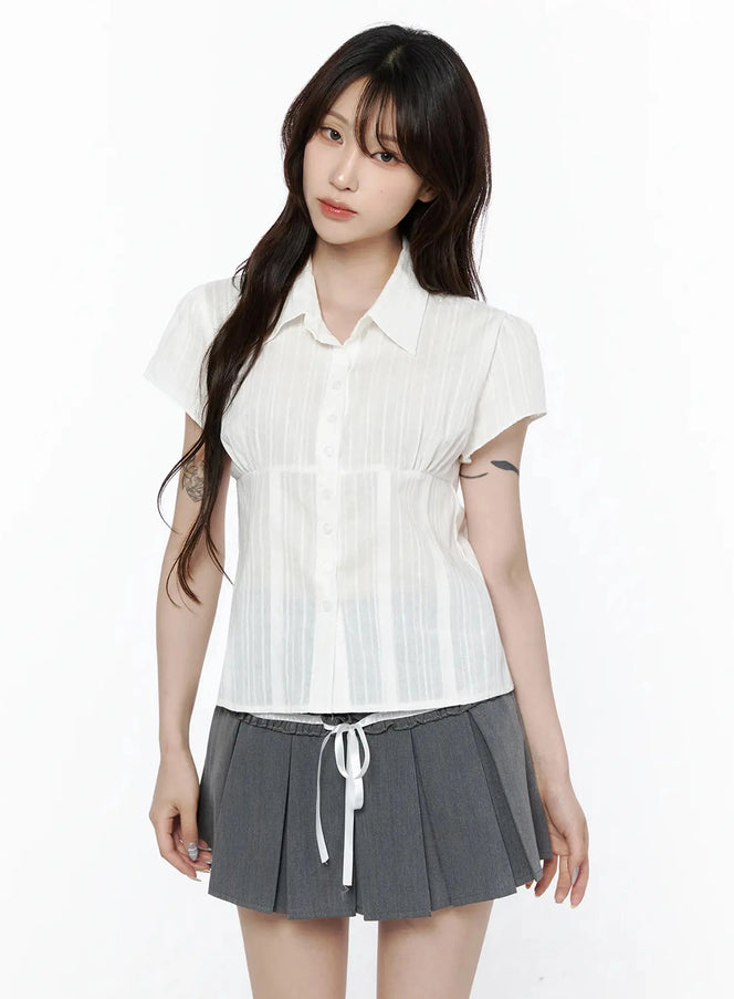 Striped Button-Up Blouse IL506 White cropped front shot on model showing point collar, button placket, empire waist seam, and sheer vertical stripe texture