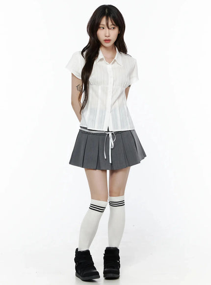Striped Button-Up Blouse IL506 White full-body front shot on model in hands-behind-back pose styled with gray pleated mini skirt and white knee-high socks