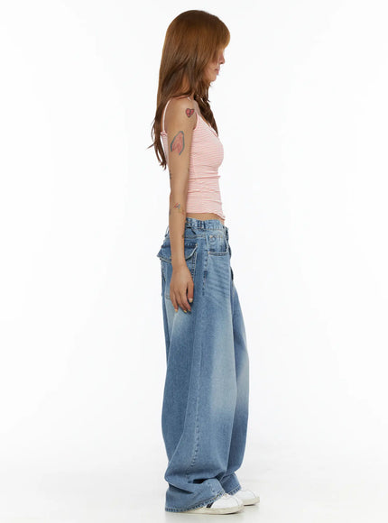 Striped Cami Top CL503 Red side model shot, red and white striped ribbed crop cami showing slim silhouette and thin spaghetti straps, styled with wide-leg blue jeans
