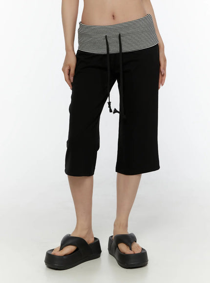Striped Capri Pants CL508 Black front cropped shot on model showing fold-over striped waistband black drawstring tassel and wide-leg capri cut