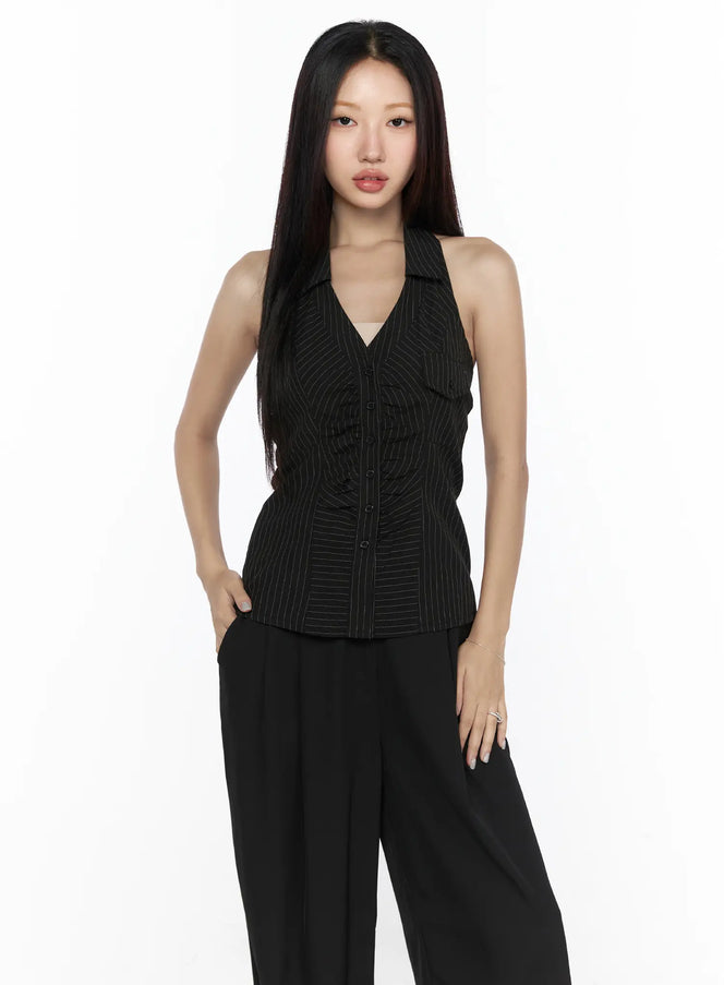 Striped Collar Halter Blouse CL524 black front view on model standing straight with hands in pockets styled with black wide-leg trousers