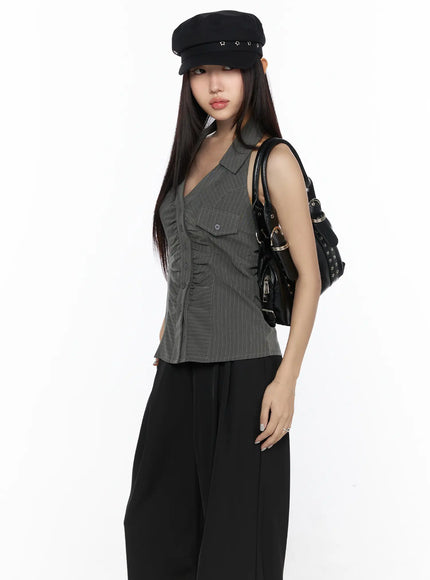 LEWKIN Striped Collar Halter Blouse CL524 Dark gray S/M angled front view on model with black baker boy cap and black bag over black wide-leg trousers