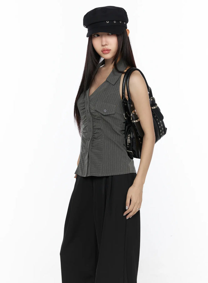 LEWKIN Striped Collar Halter Blouse CL524 Dark gray S/M angled front view on model with black baker boy cap and black bag over black wide-leg trousers