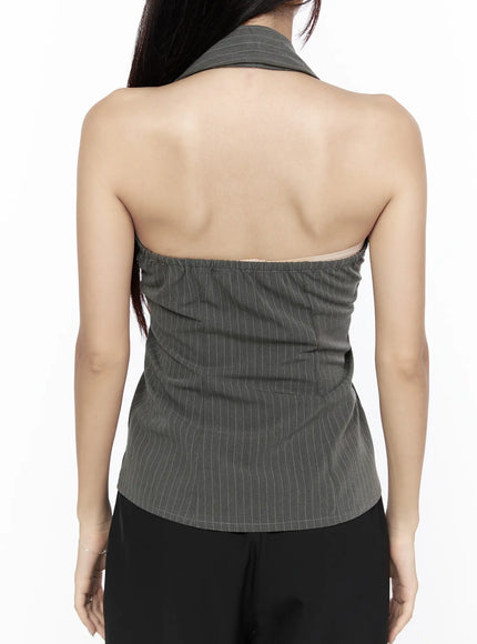 Striped Collar Halter Blouse CL524 dark gray front view on model with hand raised to hair showing V-neck collar halter design and ruched button-front silhouette