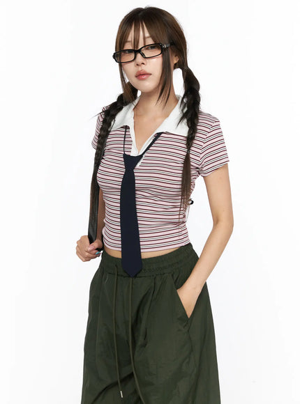 LEWKIN Striped Collared Crop Top Tee CL514 Pink S/M front shot on model wearing glasses and twin braids with navy tie and dark green wide-leg pants