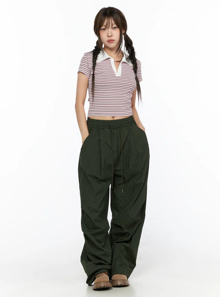 Striped Collared Crop Top Tee CL514 Pink full-length front shot on model standing upright with twin braids, white collar V-neck, styled with green parachute pants