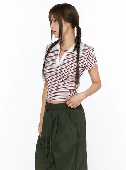 Striped Collared Crop Top Tee CL514 Pink side close-up shot on model showing white polo collar and V-neckline detail, fitted ribbed stripe fabric texture