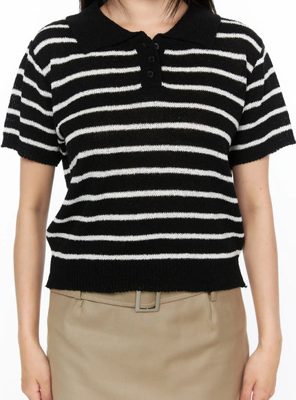 Striped Collared Knit Short Sleeve Top CL514 Black close-up front detail shot on model showing polo collar, button placket and black white stripe knit texture