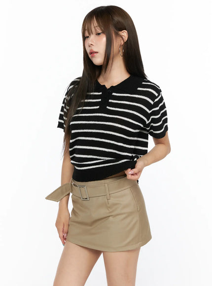 Striped Collared Knit Short Sleeve Top CL514 Black side shot on model angled left showing polo collar button placket and cropped knit silhouette