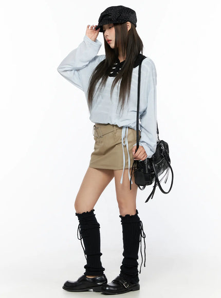 Striped Collared Knit Short Sleeve Top CL514 Blue full-body side shot on model adjusting cap, layered look with khaki mini skirt and crossbody bag