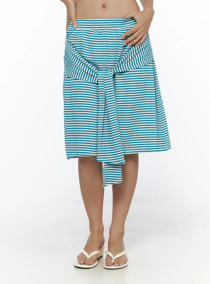 LEWKIN Striped Front-Tie Midi Skirt CL513 Blue close-up front on model waist highlighting ruched tie detail and horizontal teal white stripe knit fabric