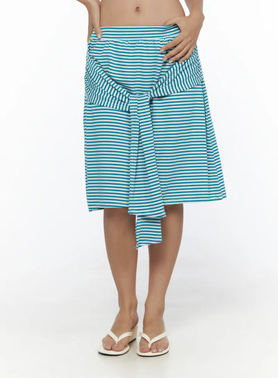 LEWKIN Striped Front-Tie Midi Skirt CL513 Blue close-up front on model waist highlighting ruched tie detail and horizontal teal white stripe knit fabric