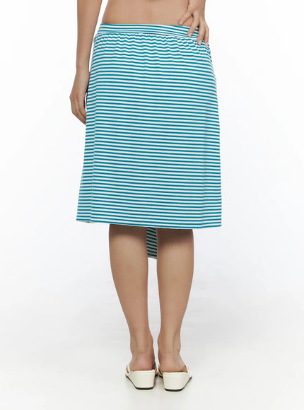 Striped Front-Tie Midi Skirt CL513 Blue back view on model showing clean A-line silhouette elastic waistband teal white stripes with white mules
