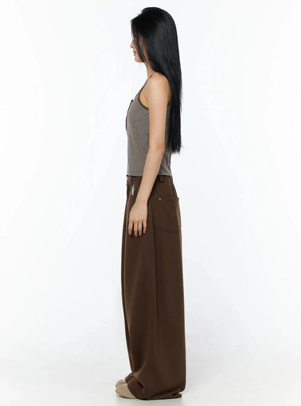 Striped Henley Tank Top IL509 Brown side-view full-length model shot showing slim spaghetti straps, fitted silhouette, and wide-leg trouser pairing