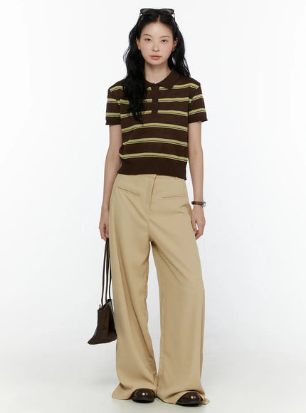 Striped Knit Polo Top CL520 Dark brown full-body front shot on model standing straight arms at sides styled with beige wide-leg trousers