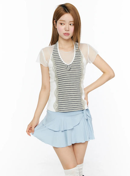 Striped Lace Trim Tank Top CL501 Beige front model shot layered under sheer short-sleeve top with lace trim and knotted detail styled with light blue wrap ruffle mini skirt and white knee socks