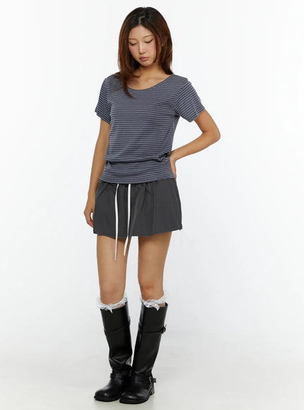Striped Off-Shoulder Top CL515 dark blue full-length front model shot looking down relaxed fit paired with gray drawstring mini skirt and tall boots