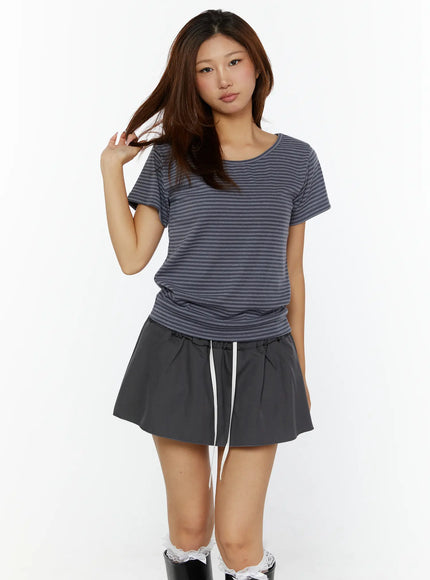 Striped Off-Shoulder Top CL515 dark blue front model shot close-up torso scoop neckline stripe knit fabric paired with gray drawstring mini skirt
