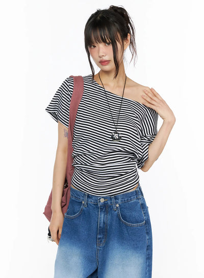 LEWKIN Striped Off-Shoulder Top CU530 Black S/M front shot on model styled with blue jeans and pink shoulder bag, one-shoulder stripe knit top
