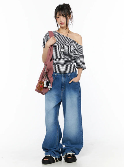 Striped Off-Shoulder Top CU530 Black full-body front shot on model wearing wide-leg jeans and sandals, carrying pink tote bag with bear charm