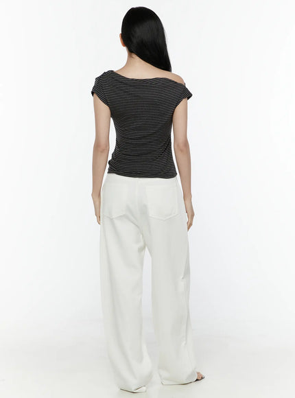 Striped Off-Shoulder Top IL506 Dark gray back model shot displaying clean back silhouette, cropped hem, and ruched knit finish with white trousers