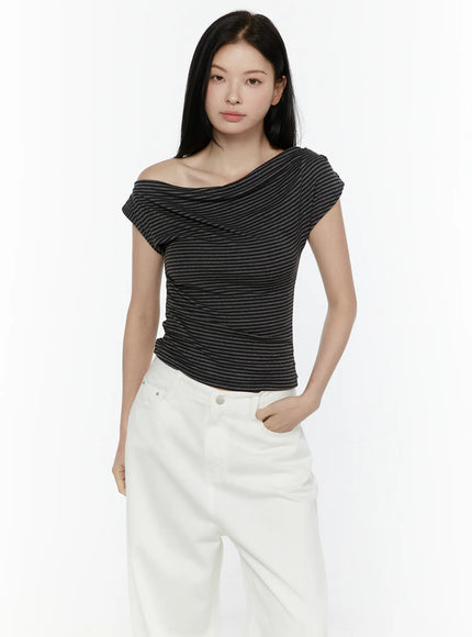 Striped Off-Shoulder Top IL506 Dark gray half-body front model shot showing off-shoulder drape and cross-ruched front detail with white jeans