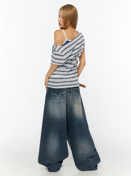 Striped Off-Shoulder Top IL524 Dark blue back shot on model showing rear view of open-knit stripe top with off-shoulder detail and layered camisole underneath