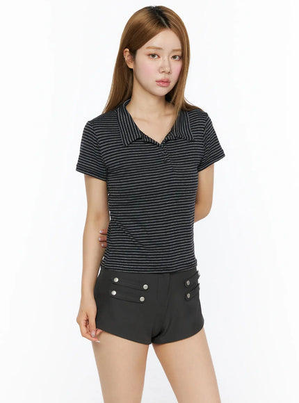 Striped Slim Fit Polo Shirt CL502 Black front model shot, slim-fit striped polo with open collar, paired with black mini shorts, three-quarter crop view