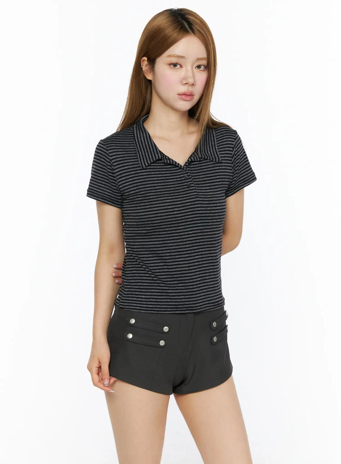 Striped Slim Fit Polo Shirt CL502 Black front model shot, slim-fit striped polo with open collar, paired with black mini shorts, three-quarter crop view