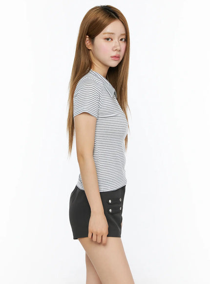 Striped Slim Fit Polo Shirt CL502 White side close-up model shot, fitted striped polo collar and sleeve detail visible, paired with black shorts, no accessories