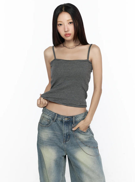 Striped Square Neck Cami CL524 dark gray front close-up on model lifting hem to show cropped silhouette with fine horizontal stripes and chain necklace