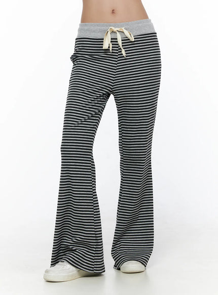 Striped Sweatpants CL513 black-gray front cropped shot on model showing drawstring waistband and wide flared leg with ribbed stripe knit