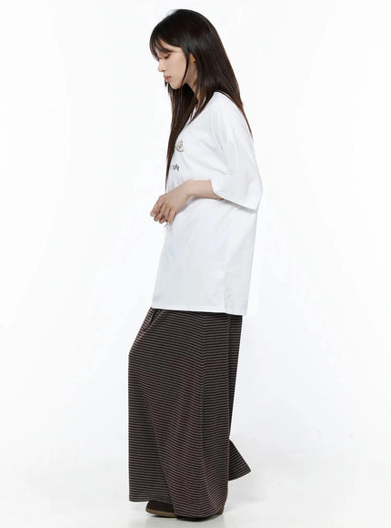 Striped Tie Maxi Skirt IL506 Brown side view on model styled with white oversized tee, showing A-line silhouette and maxi length