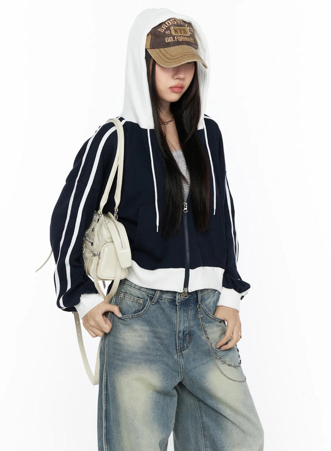 LEWKIN Striped Track Hoodie CL524 Dark blue S/M front shot on model wearing cap with hood up, paired with wide-leg jeans, cropped zip-up silhouette with white stripe sleeves