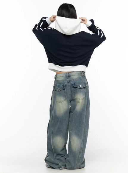 Striped Track Hoodie CL524 Dark blue back shot on model pulling up white hood with both hands raised, white stripe sleeves and ribbed waistband detail visible