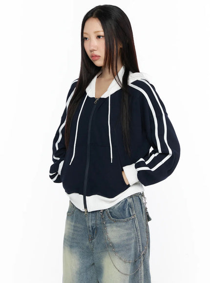 Striped Track Hoodie CL524 Dark blue close-up front shot on model, zip-up hoodie with white drawstring hood and double white stripes on sleeve, ribbed contrast hem