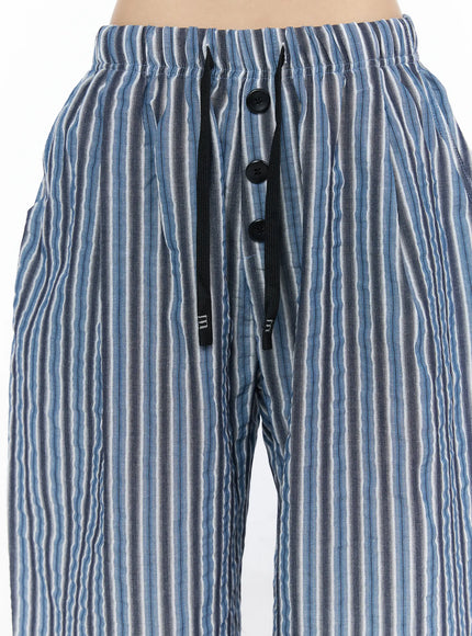 Striped Wide-Leg Trousers CL502 Blue close-up detail of front waistband showing elastic waist three black buttons and black drawstring cord