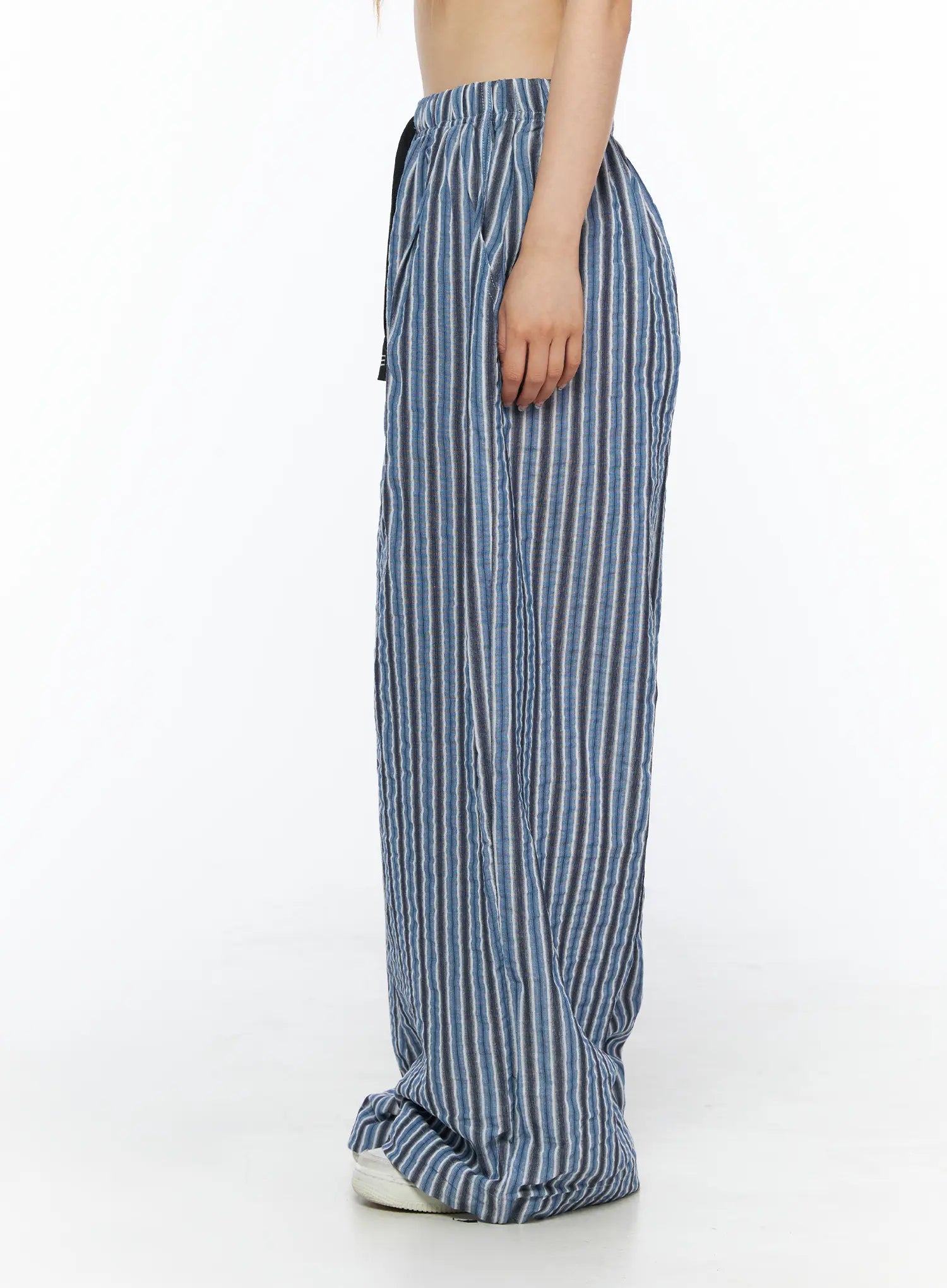 Striped Wide-Leg Trousers CL502 Blue side shot on model showing relaxed wide-leg fit with crinkle texture and black drawstring at waist