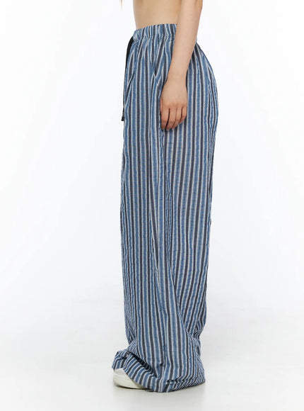Striped Wide-Leg Trousers CL502 Blue side shot on model showing relaxed wide-leg fit with crinkle texture and black drawstring at waist