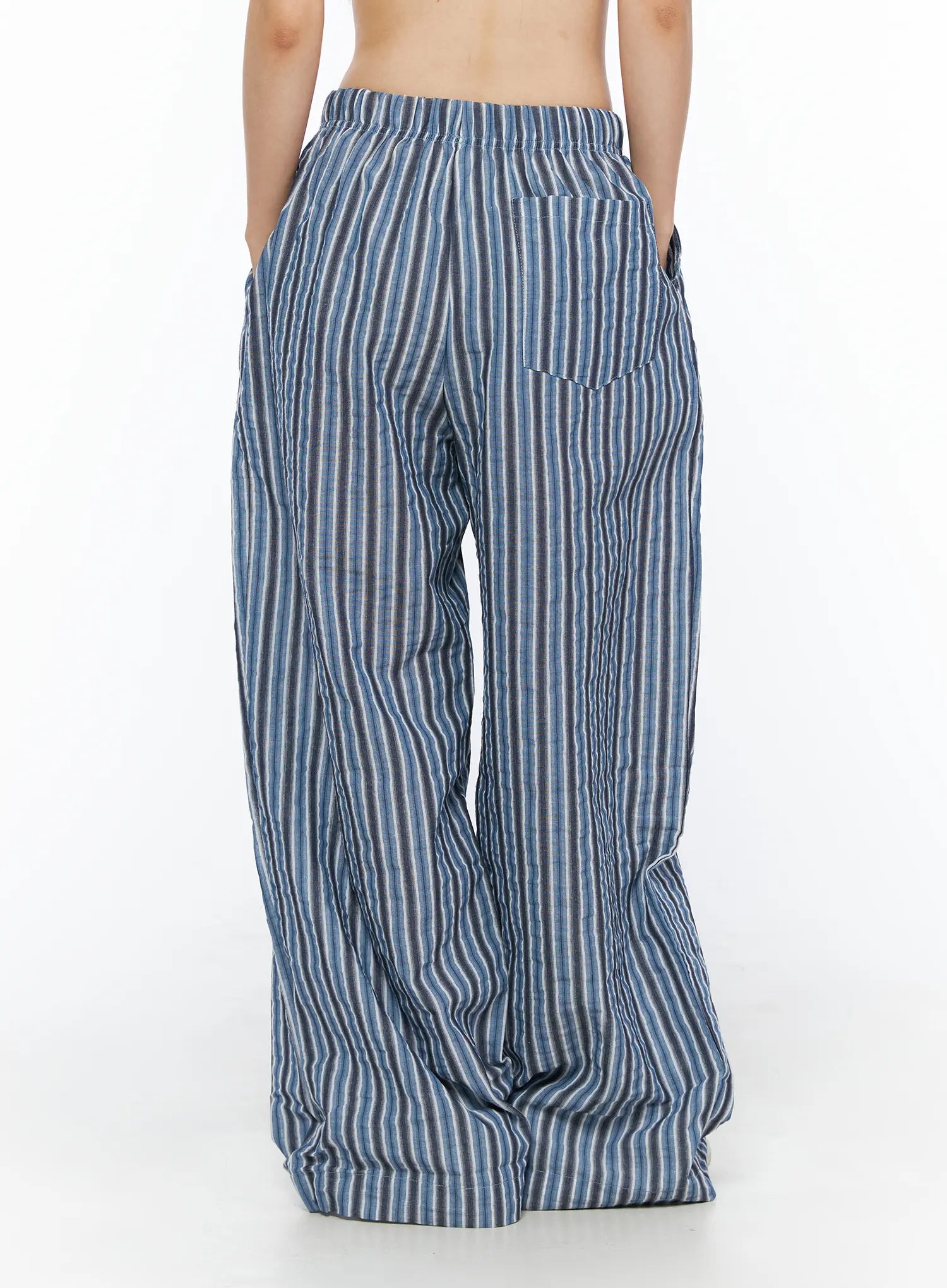 Striped Wide-Leg Trousers CL502 Blue back shot on model showing single back patch pocket and elastic waistband with crinkle stripe fabric