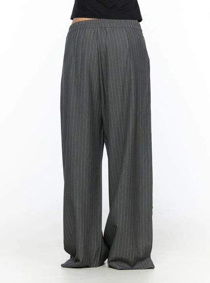 Striped Wide Slacks CL510 gray back close-up shot on model showing elastic waistband and wide-leg pinstripe fabric drape from waist to hem
