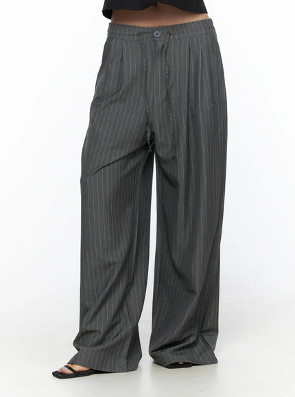 Striped Wide Slacks CL510 gray front cropped model shot from waist to ankle highlighting pleated wide-leg fit, pinstripe pattern and floor-length hem