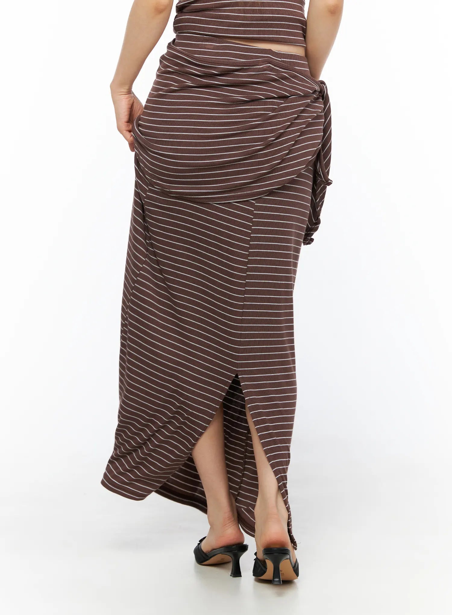 Striped Wrap Maxi Skirt CL502 Brown back view on model revealing back center slit draped wrap waist and black kitten heel sandals