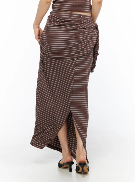 Striped Wrap Maxi Skirt CL502 Brown back view on model revealing back center slit draped wrap waist and black kitten heel sandals