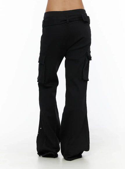 Studded Bootcut Pants CL503 Black back close-up on model showing low-rise waistband, belt loops, rear cargo pockets, and wide flared leg